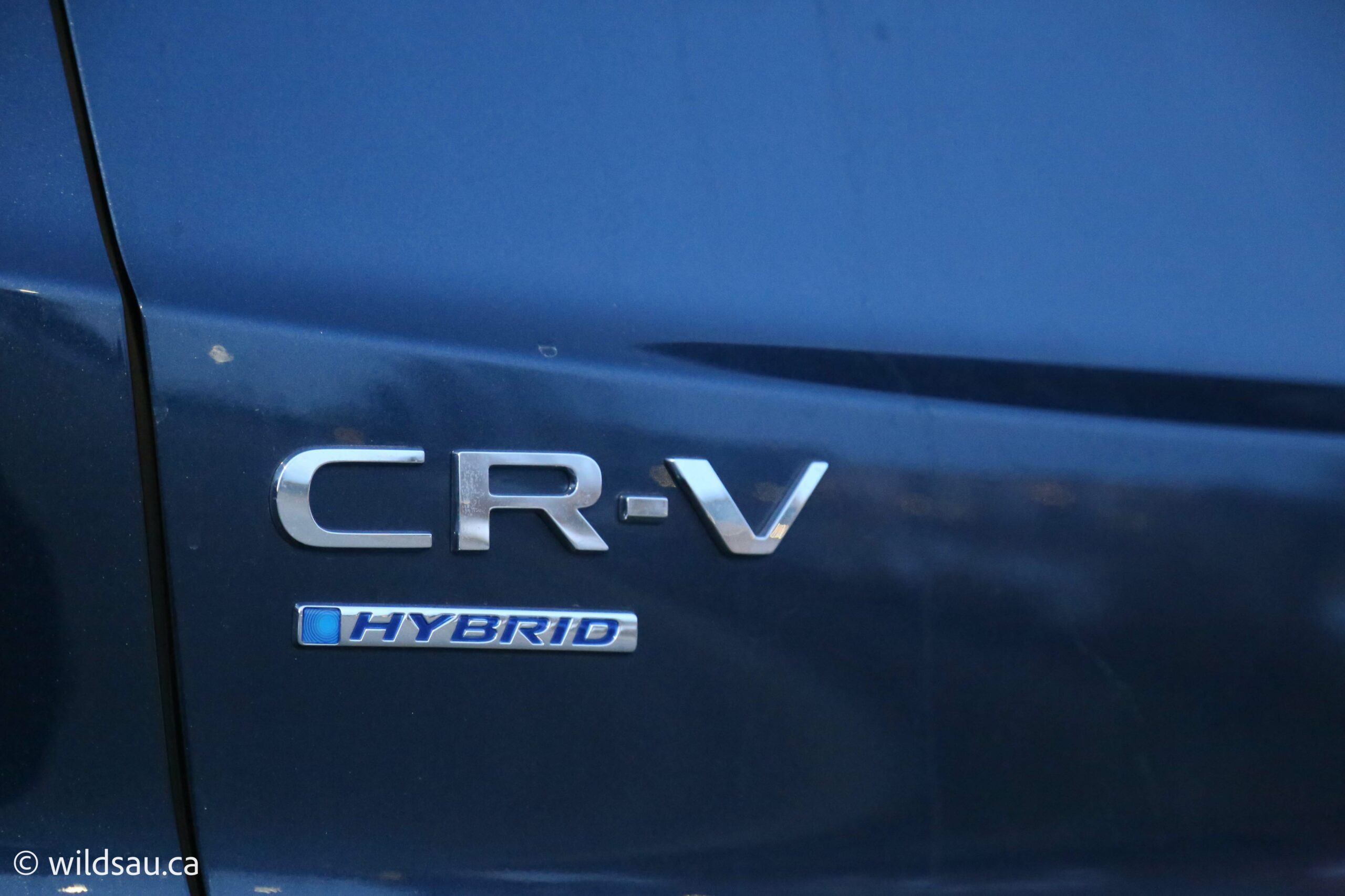 Touring hybrid badge